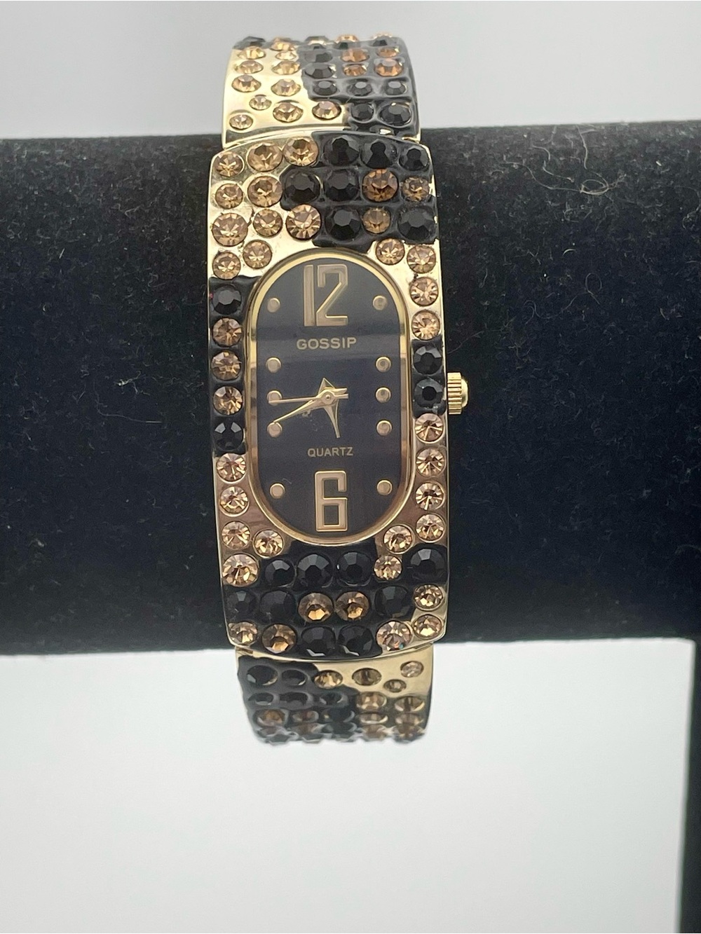 Gossip Gold-Tone Black and Champagne Crystal Bangle Watch. In original box.